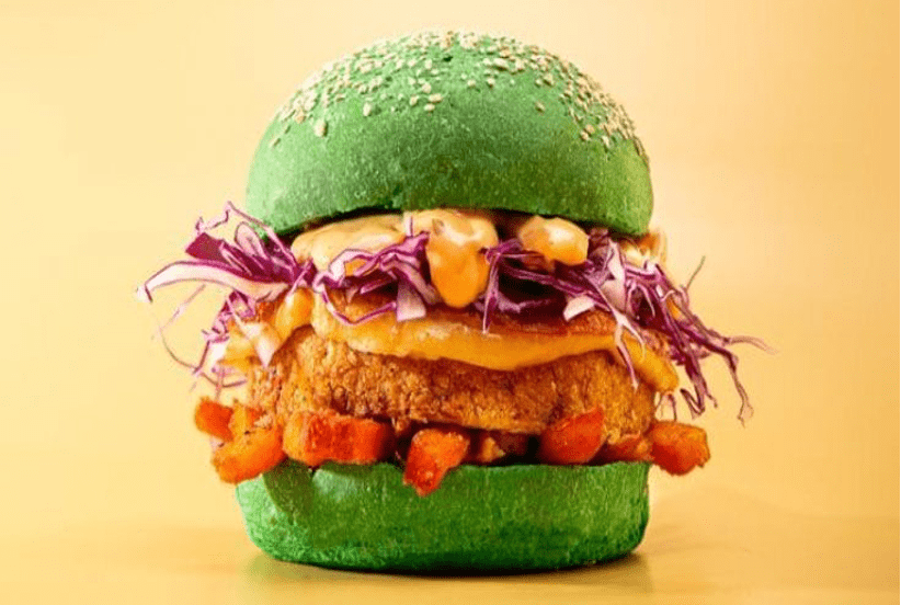 Immagine di un hamburger in un panino verde